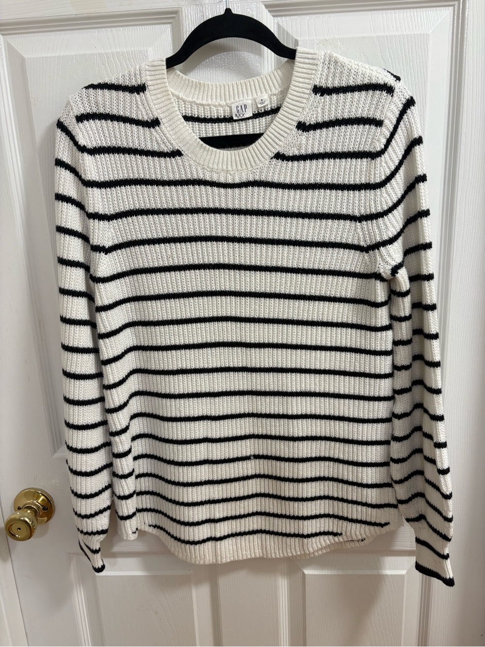 Gap crewneck sweater featuring classic black and cream horizontal stripes